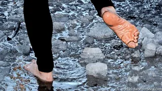 Young barefoot girl Anastasia walks on frozen ground, mud, ice and melt snow (Part 4 of 6)