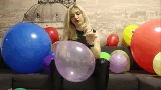 Katya in latex popping balloons