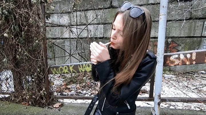 Natasha smoking in totally leather outfit