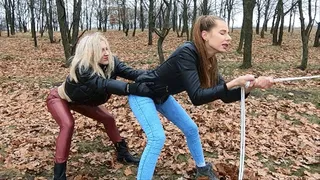 Katya and Nastya desperately pulling the rope