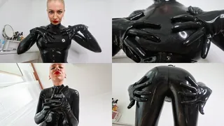 Mistress Katya oiling her latex catsuit