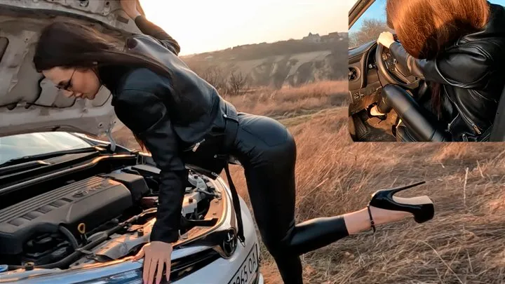 Jade in a leather outfit trying to start a Toyota