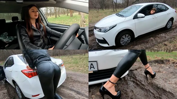 Jade in a leather outfit gets stuck in the mud and pushes the car