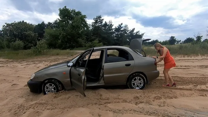 Anya driving through the sand and getting stuck