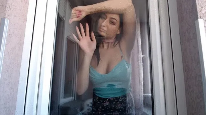 Stasha's hands on glass door