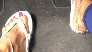 Sexy feet in flipflop driving