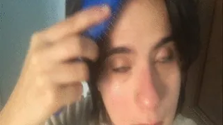 I comb my dark hair in slow motion