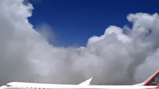 Tiny Plane Flying in Sky