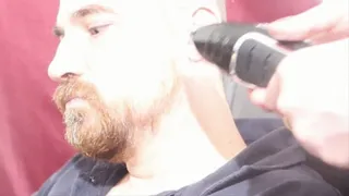 Close up head shaving and facial trimming
