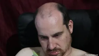 Shaving his head and trimming up his facial hair,