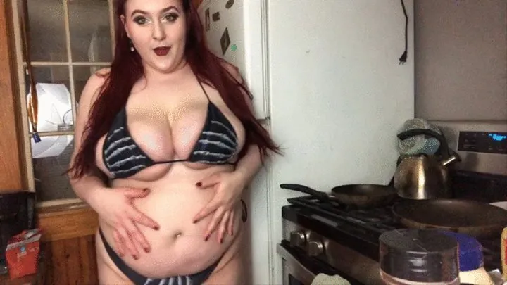 Busty big belly feedee cooks and stuffs in tiny bikini