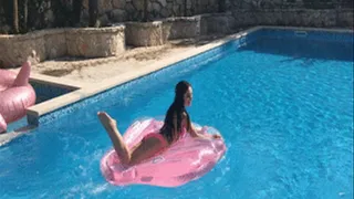 Bikini strip tease on my new pink shell inflatable