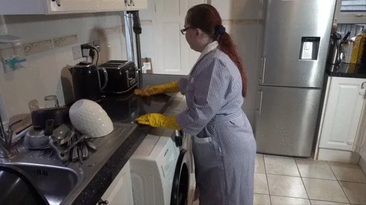 Maid cleaning up in rubber gloves