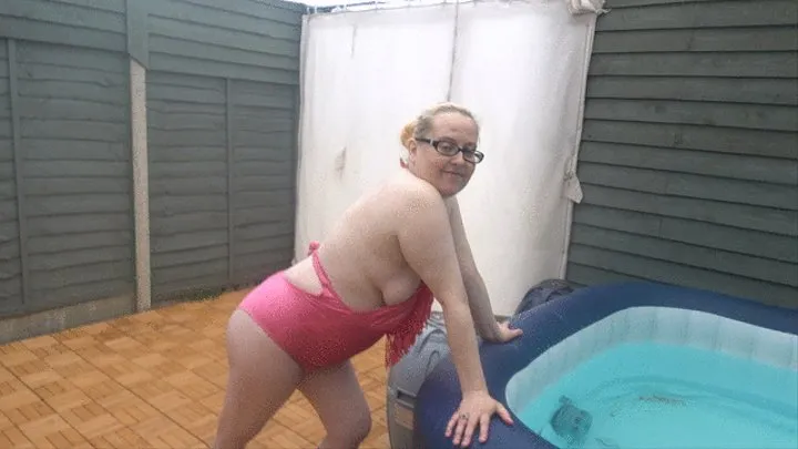 Swimsuit bouncing boobs in the hot tub