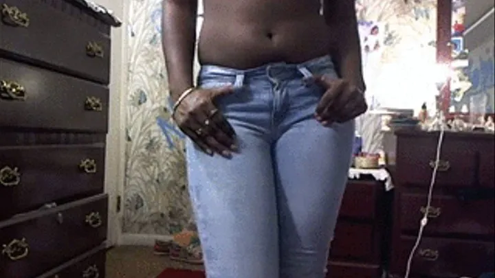 Shy dark skinned gal pissing her jeans