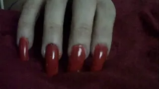 Woman with Finger Nail Fetish and nails in a light red