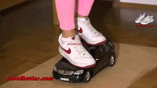 Jane crushes a Mercedes model car under her Nike Air For ce sneakers (0054)