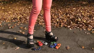 Girl in platform sandals on toy cars 2 (0053)