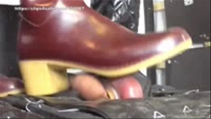 Extreme Ball Stomping and Trampling with heel rubber boots on cock board