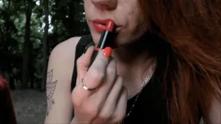 Make red lips and smoke cigarette in park