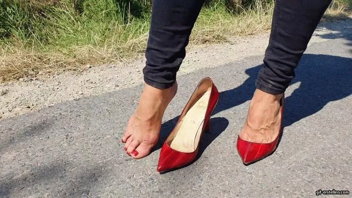 red Louboutins barefoot on a hot summer day