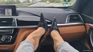 shoeplay on the dashboard on the highway to Cologne