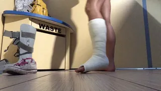 Blonde in leg cast gets dressed after tan