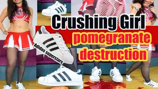 Cheerleader girl crushes a pomegranate to a pulp vegetables Crush trampling crushing Pomegranate to a pulp with their Adidas superstars and nylons