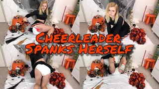 Diapered Cheerleader Spanks Herself