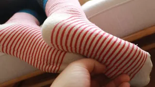 Female doctor's cute cotton socks and bare feet tickling