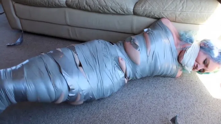 Curly blue haired babe mummified and gagged!