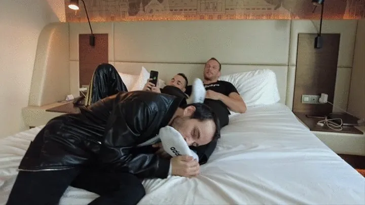 Three boys, feet and a hotel room