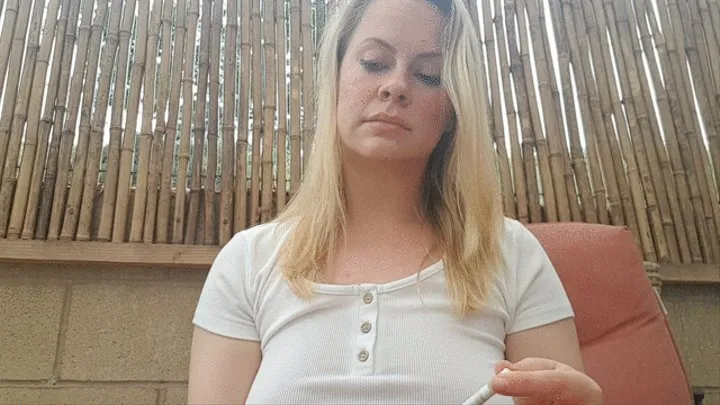 Mistress Stevie Smoking on the Patio after Beating your Bottom while you stand in the corner on display