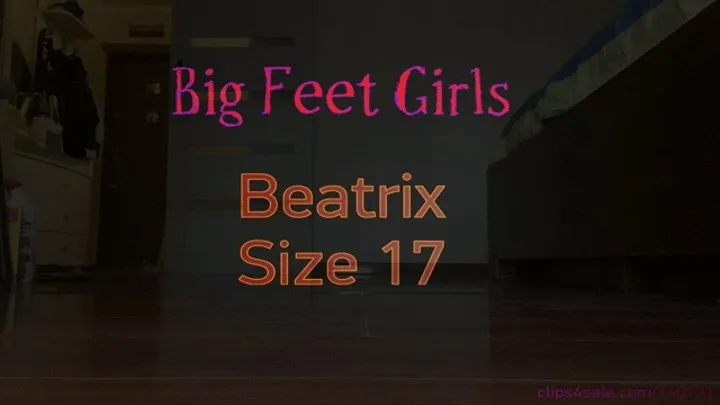 Amazon Beatrix comparing her size 17 feet to objects - soles view