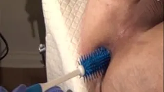 Femdom anal treatment with the rough brush