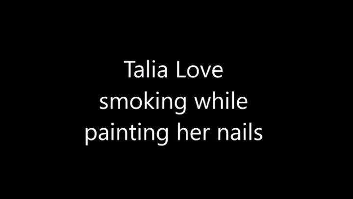 Talia Love smoking Marlboro Red 100 while paint her nails