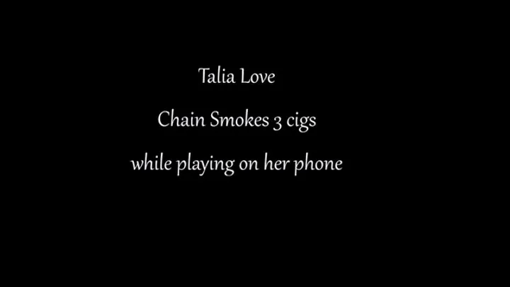 Talia Love chain smokes while playing on her phone