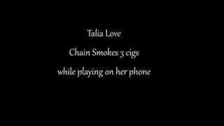 Talia Love chain smokes while playing on her phone