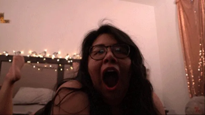 Yawning in bed with feet showing