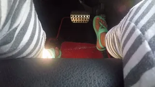 Strappy turquoise sandals behind the wheel PEDAL PUMPING