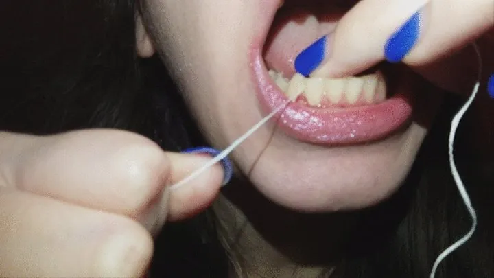 cleaning my teeth with dental floss