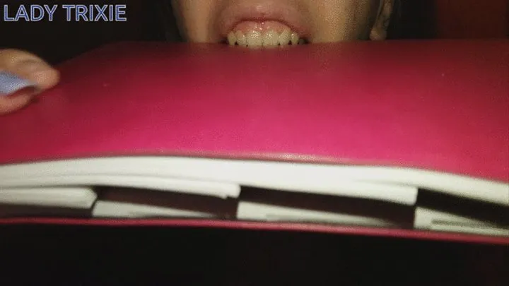 Biting a notebook