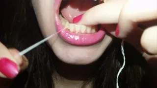 Cleaning my teeth with dental floss