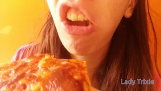 Chewing and eating a pizza