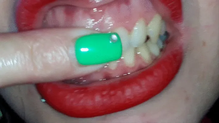 touching my gums with my green nails