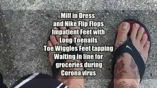 Latina Milf in Dress and Nike Flip Flops Impatient sweaty feet on s hot day with Long Toenails Toe Wiggles Feet tapping Waiting in line for groceries during Corona virus