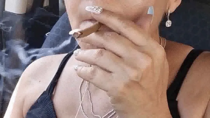 Sexy Smoking in car Latina milf listens to spanish radio and smokes a cigar coughing ocassionally