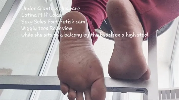 Under Giantess Unaware Latina Milf Lolas Sexy wrinkled Soles Foot Fetish cam Wiggly toes Rear view while she sits on a balcony by the beach on a high stool