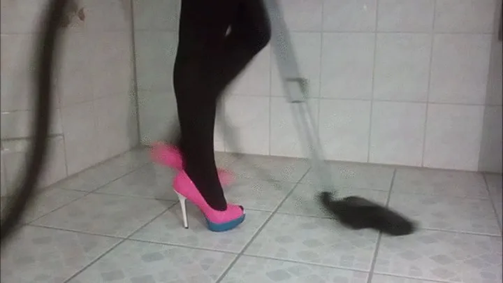 Posing and vacuuming in pink High Heels