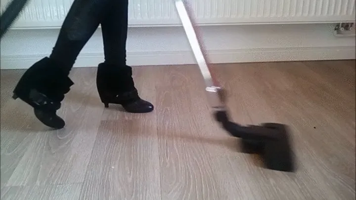 Vacuuming the Floor in black ankle Boots with glitter Stones